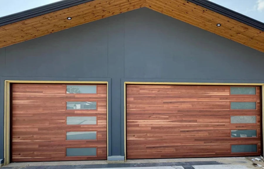 Custom garage door with modern wooden panel design and sleek automated opening system installed at a residential home, enhancing security and aesthetics.