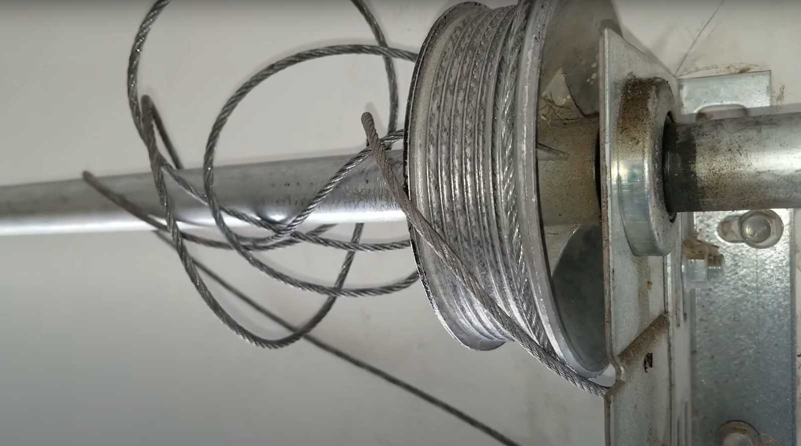 Garage door cable misaligned and need expert technician repair.